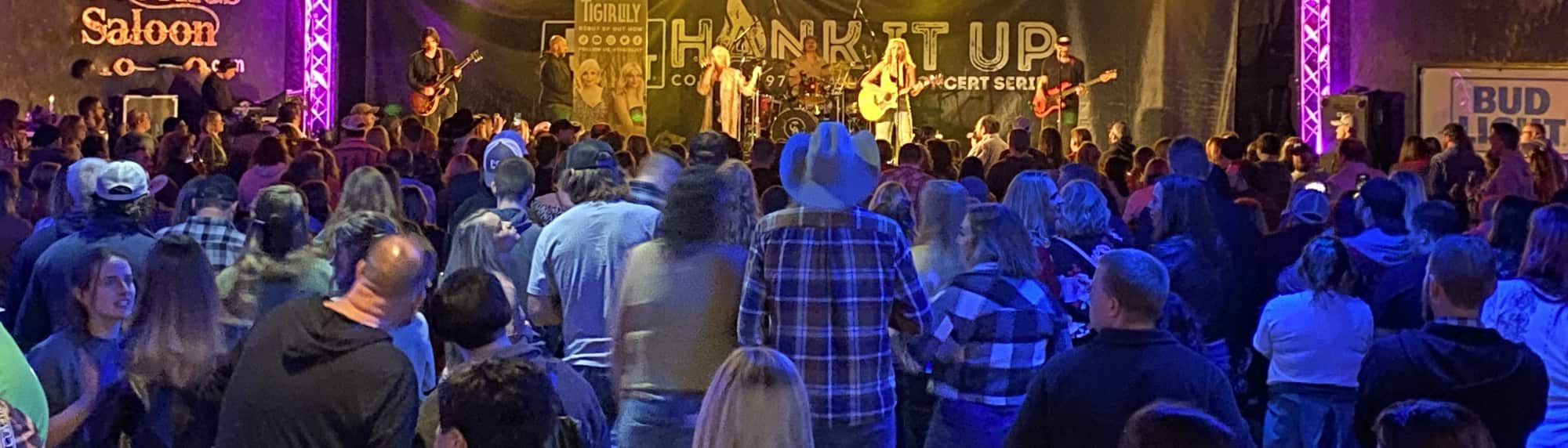 country concert with fans wearing cowboy hats Los Angeles